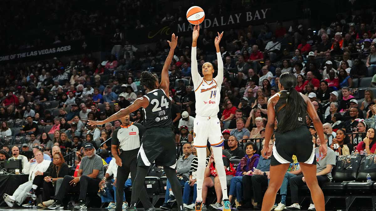 Phoenix Mercury forward DeWanna Bonner (14) shoots against Las Vegas Aces guard Jewell Loyd (24) during the second quarter of game one of the 2025 WNBA Finals at Michelob Ultra Arena.