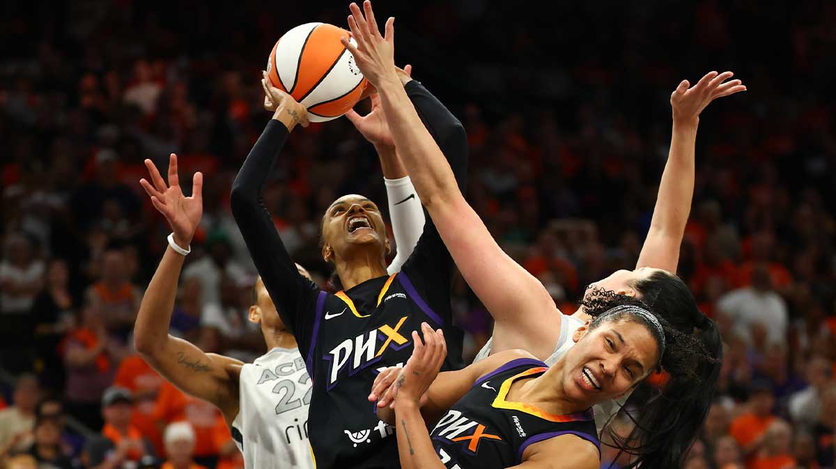 Phoenix Mercury forward DeWanna Bonner (14) shoots the ball over Las Vegas Aces center A'ja Wilson (22) in the second half during game three of the 2025 WNBA Finals at PHX Arena.