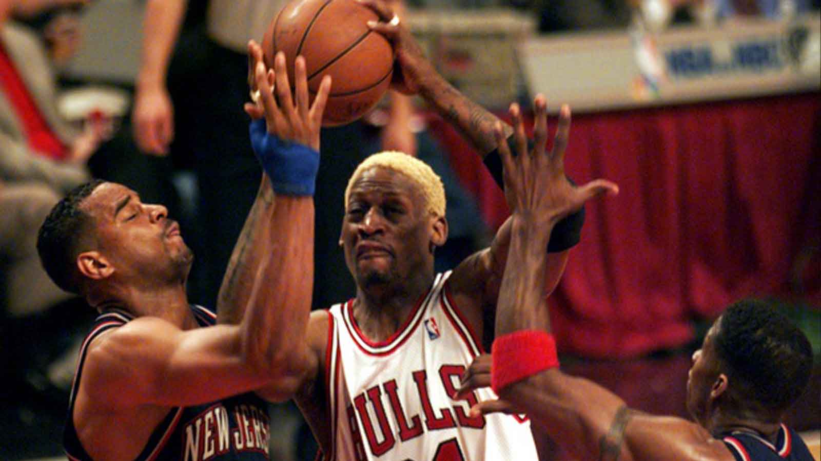 Chicago's Dennis Rodman (91), middle, charges to the basket between New Jersey's Jayson Williams (55), left, and Kendall Gill (13), right.