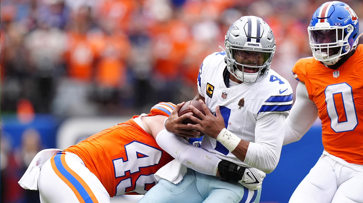 Denver Broncos linebacker Alex Singleton (49) tackles Dallas Cowboys quarterback Dak Prescott (4)