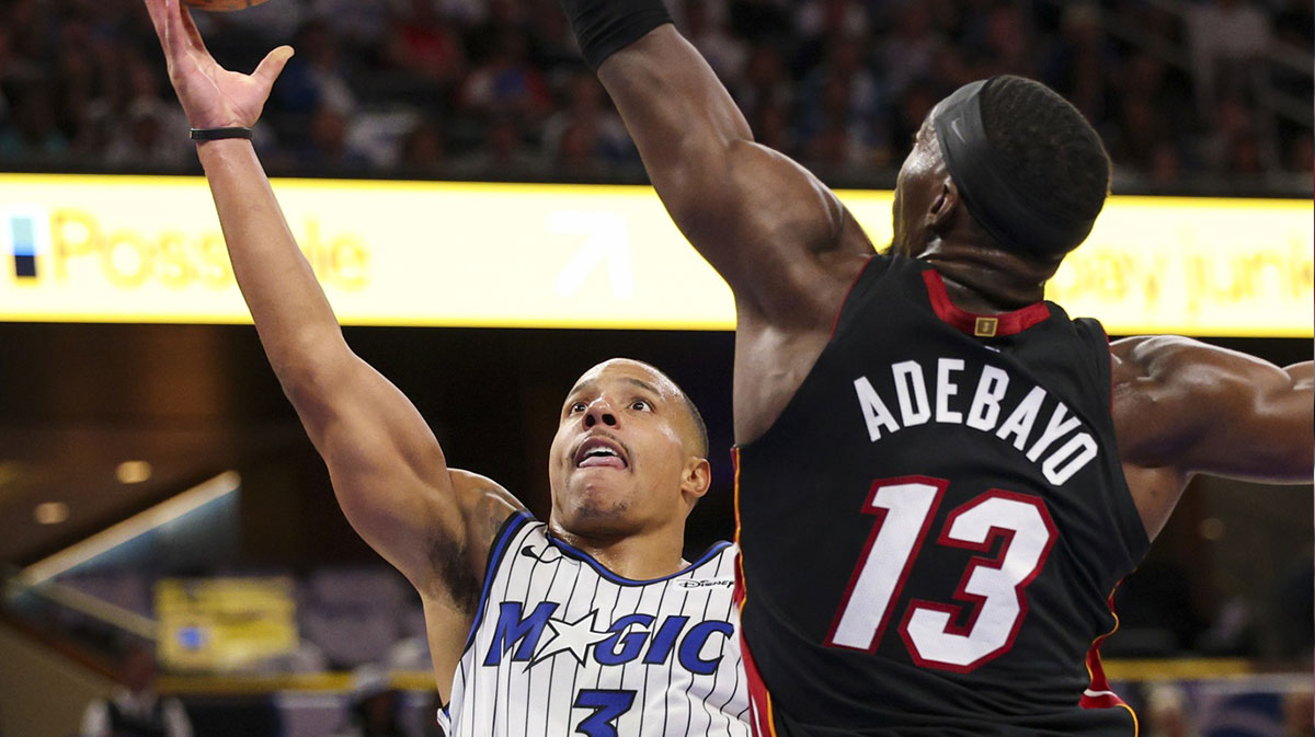 Orlando Magic guard Desmond Bane (3) is guarded by Miami Heat center Bam Adebayo (13) in the third quarter at Kia Center.
