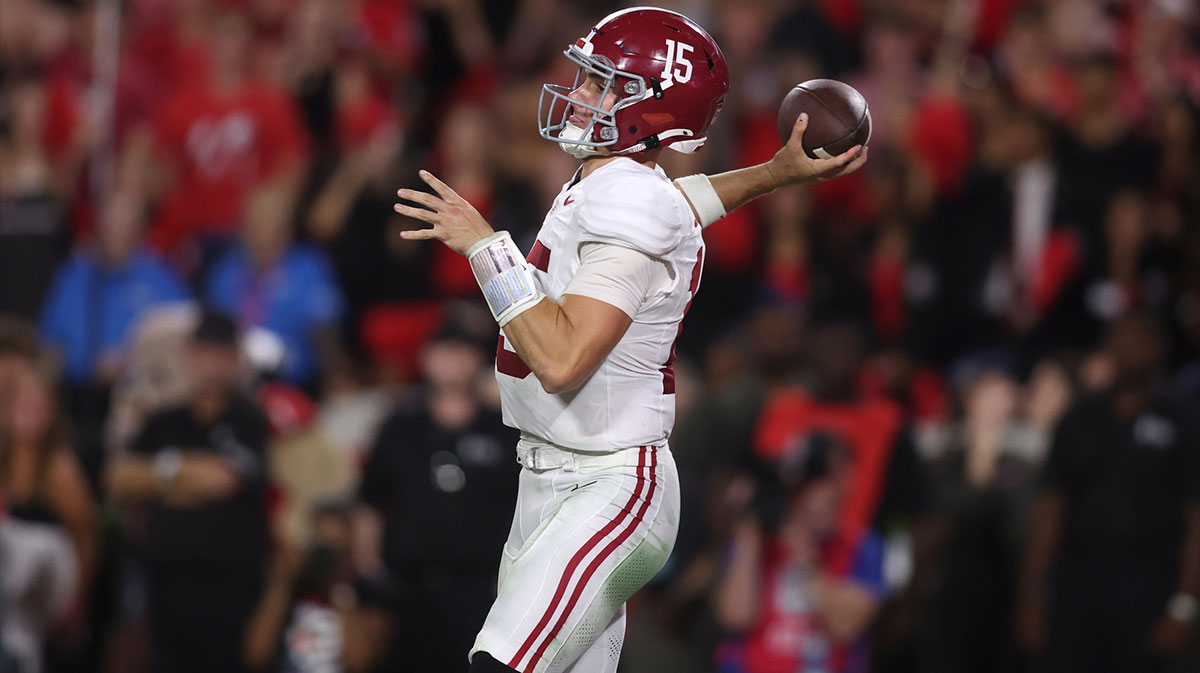 Alabama Crimson Tide quarterback Ty Simpson (15) passes against the Georgia Bulldogs in the second half at Sanford Stadium.