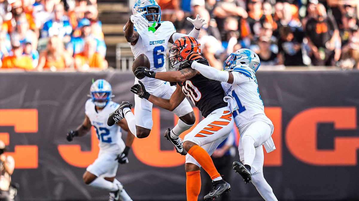 Detroit Lions cornerback Terrion Arnold (6), left, and cornerback Amik Robertson (21) break a pass intended for Cincinnati Bengals wide receiver Andrei Iosivas (80) during the first half at Paycor Stadium in Cincinnati on Sunday, Oct. 5, 2025.