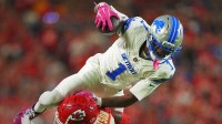 Detroit Lions wide receiver Jameson Williams (1) leaps over Kansas City Chiefs cornerback Jaylen Watson (35) during the first half at GEHA Field at Arrowhead Stadium.