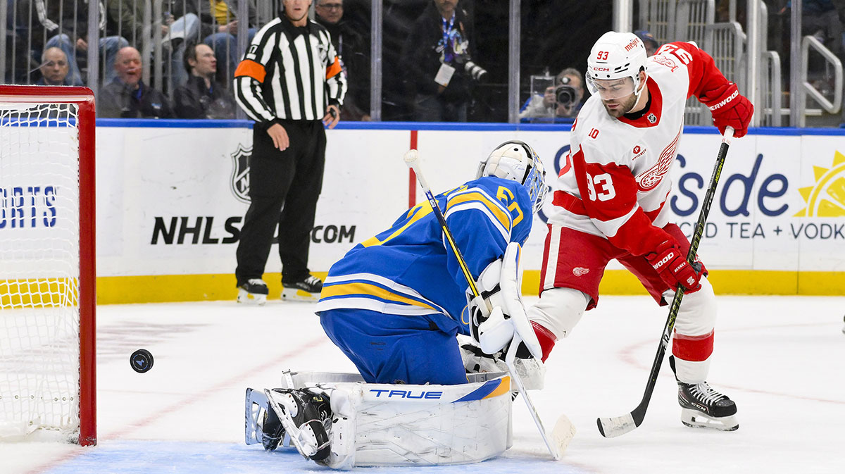 Detroit Red Wings right wing Alex Debrincat (93) scores against St. Louis Blues goaltender Jordan Binnington (50) during the first period at Enterprise Center.