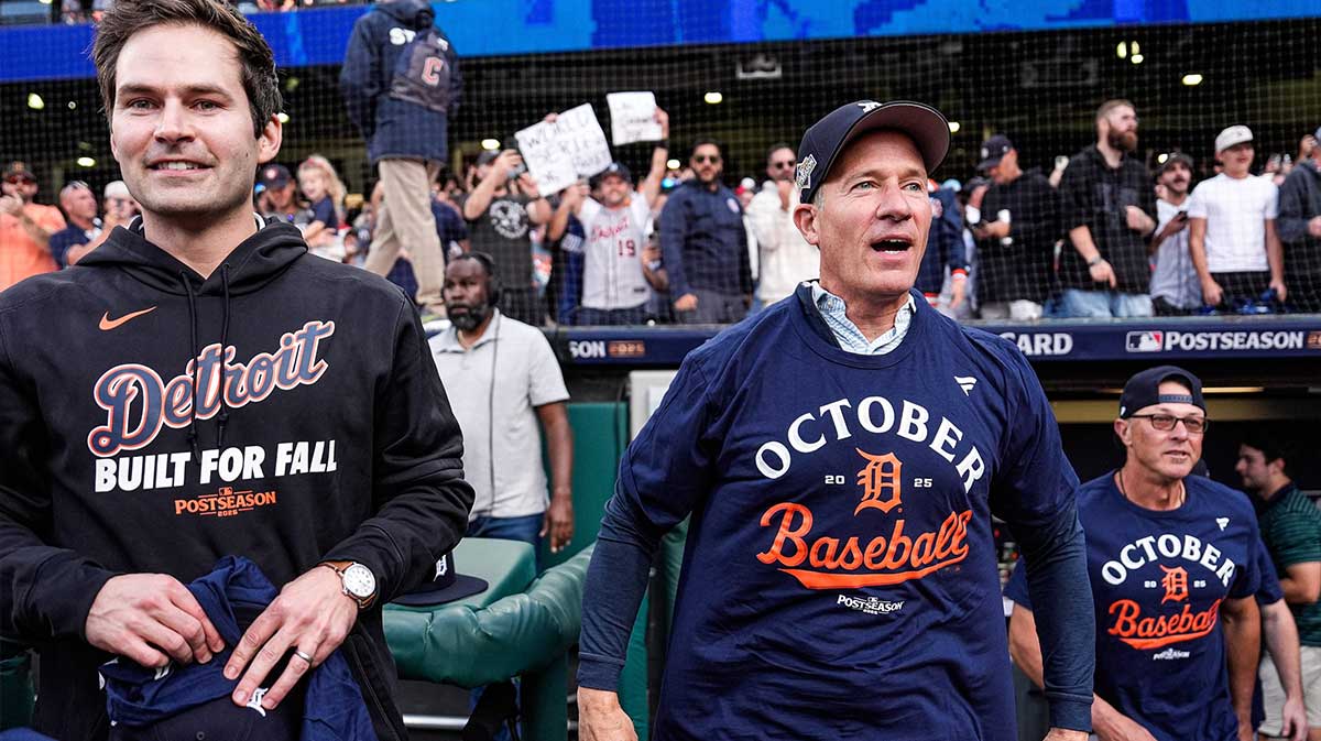 Detroit Tigers team owner Chris Ilitch, center, next to president for baseball operations Scott Harris celebrates 6-3 win over Cleveland Guardians in Game 3 of AL wild-card series at Progressive Field in Cleveland on Thursday, Oct. 2, 2025.