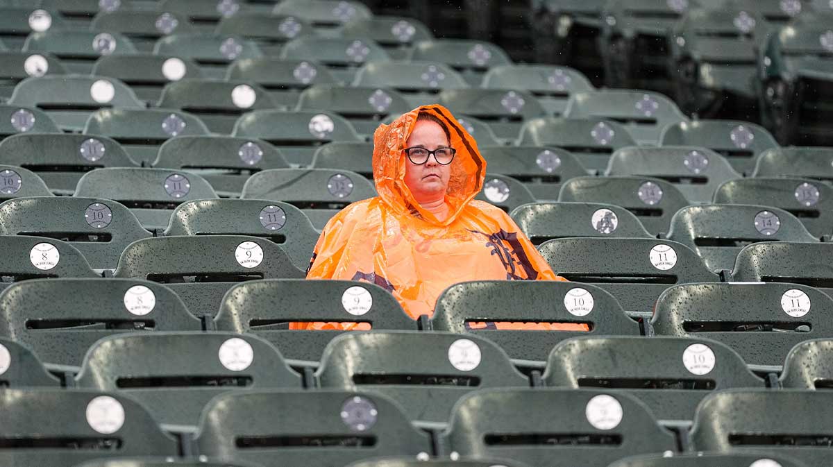 Baseball fans wait in stands due to rain delay at ALDS Game 3 between Detroit Tigers and Seattle Mariners at Comerica Park in Detroit on Tuesday, Oct. 7, 2025.