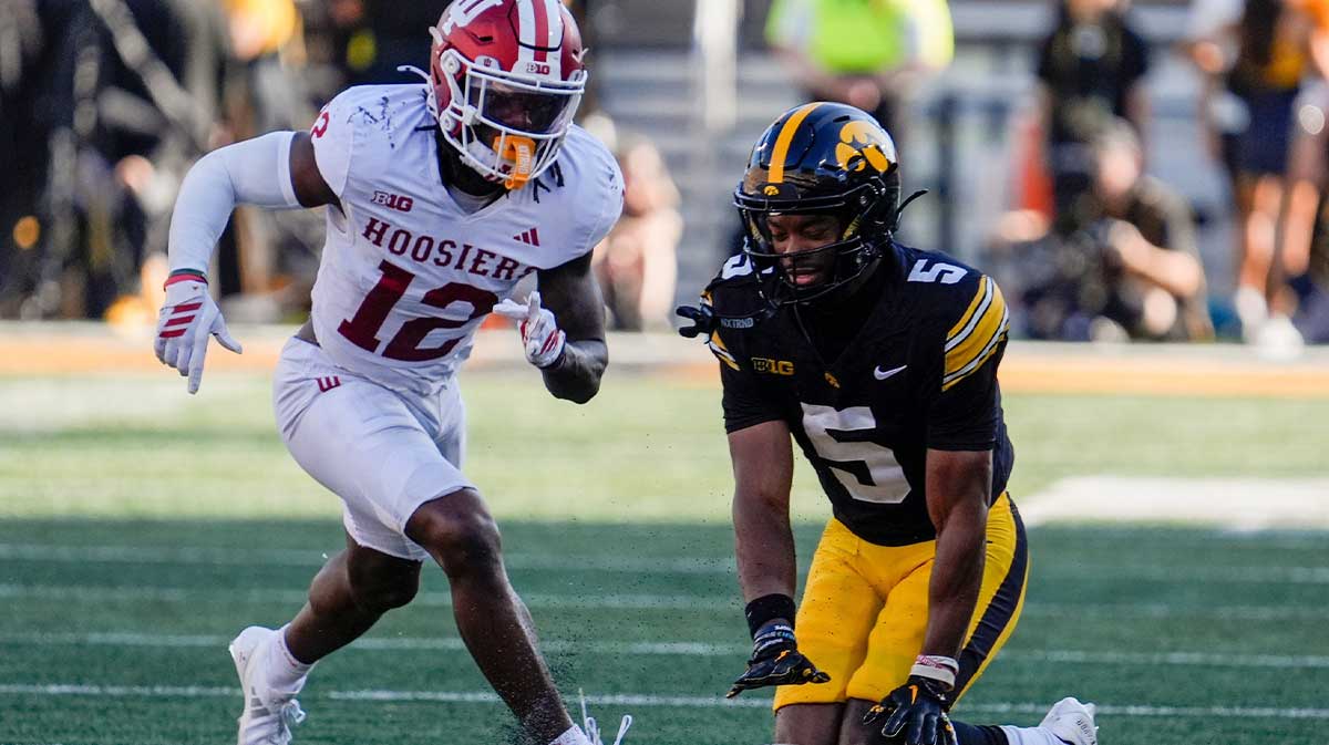 A pass meant for Iowa Hawkeyes wide receiver Jacob Gill (5) falss incomplete as Indiana Hoosiers defensive back Devan Boykin (12) defends Sept. 27, 2025 at Kinnick Stadium in Iowa City, Iowa.