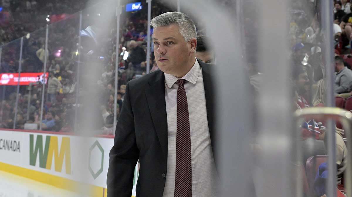 New Jersey Devils head coach Sheldon Keefe makes his way to the bench before the third period of the game against the Montreal Canadiens at the Bell Centre.