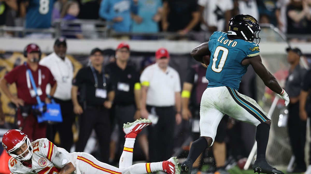 Jacksonville Jaguars linebacker Devin Lloyd returns and interception for a touchdown against Kansas City Chiefs quarterback Patrick Mahomes (15) during the second half at EverBank Stadium