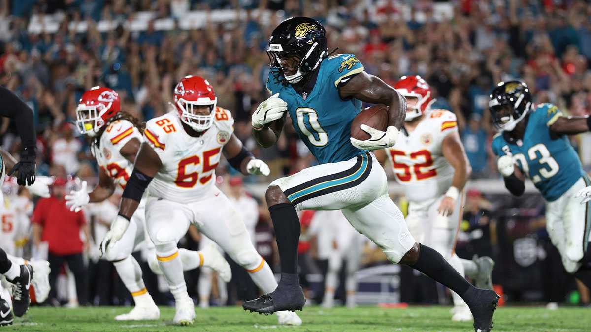 Jacksonville Jaguars linebacker Devin Lloyd intercepts a pass and returns it for a touchdown during the second half against the Kansas City Chiefs at EverBank Stadium.