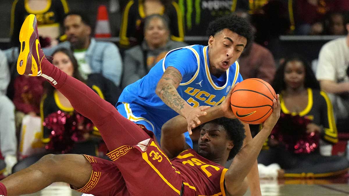 Southern California Trojans guard Bronny James (6) and UCLA Bruins forward Devin Williams (22) battle for the ball in the first half at Galen Center.