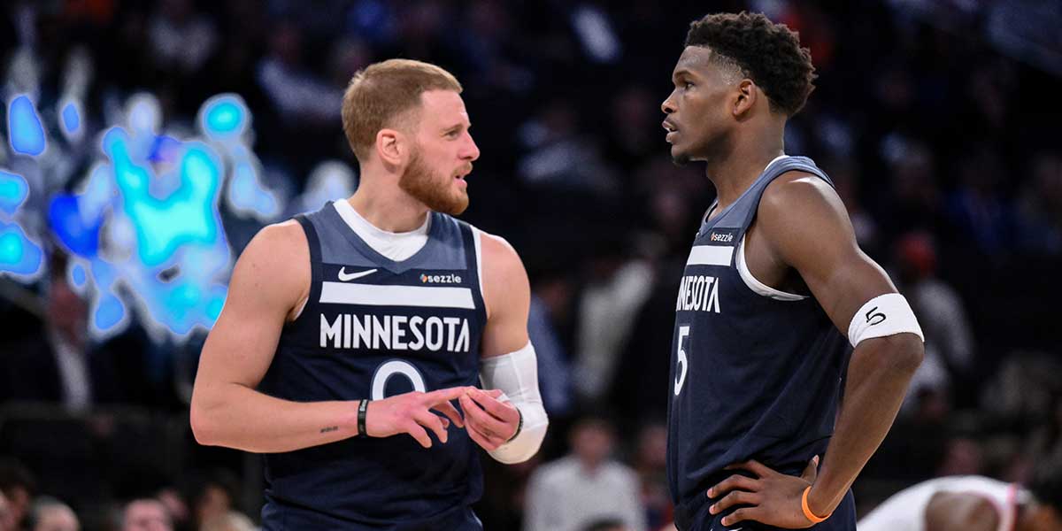 Minnesota Timberwolves guard Donte Divincenzo and guard Anthony Edwards (5) talk during the second half against the New York Knicks at Madison Square Garden.