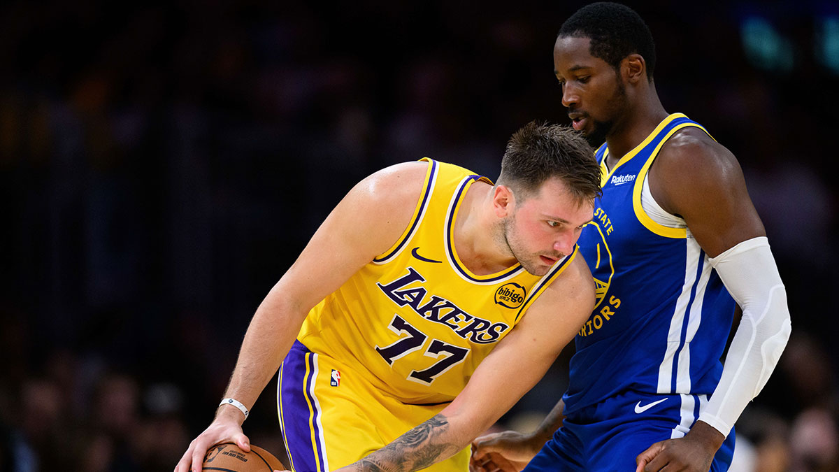 Los Angeles Lakers guard Luka Doncic (77) looks to drive against Golden State Warriors forward Jonathan Kuminga (1) during the second half at Crypto.com Arena.