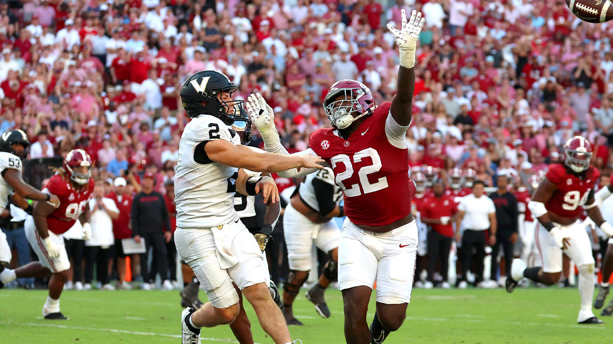 Vanderbilt Commodores quarterback Diego Pavia (2) is pressured by Alabama Crimson Tide defensive lineman LT Overton (22) during the second half at Saban Field at Bryant-Denny Stadium.