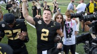 Vanderbilt Commodores quarterback Diego Pavia (2) celebrates the win with the student section against the Louisiana State Tigers during the second half at FirstBank Stadium.