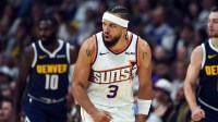 Phoenix Suns forward Dillon Brooks (3) reacts after making a shot during the first half against the Denver Nuggets at Ball Arena.