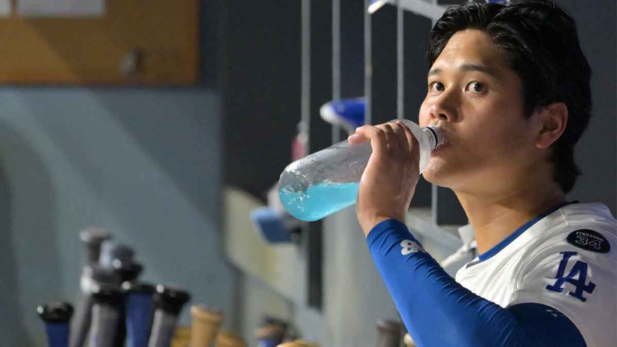 Los Angeles Dodgers designated hitter Shohei Ohtani (17) looks on from the dugout in the seventh inning against the Cincinnati Reds during game two of the Wildcard round for the 2025 MLB playoffs at Dodger Stadium.