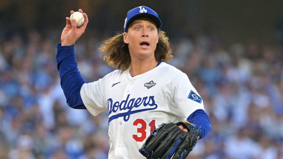 Los Angeles Dodgers pitcher Tyler Glasnow (31) throws to first for an out against Toronto Blue Jays second baseman Bo Bichette (11) in the second inning during game three of the 2025 MLB World Series at Dodger Stadium.