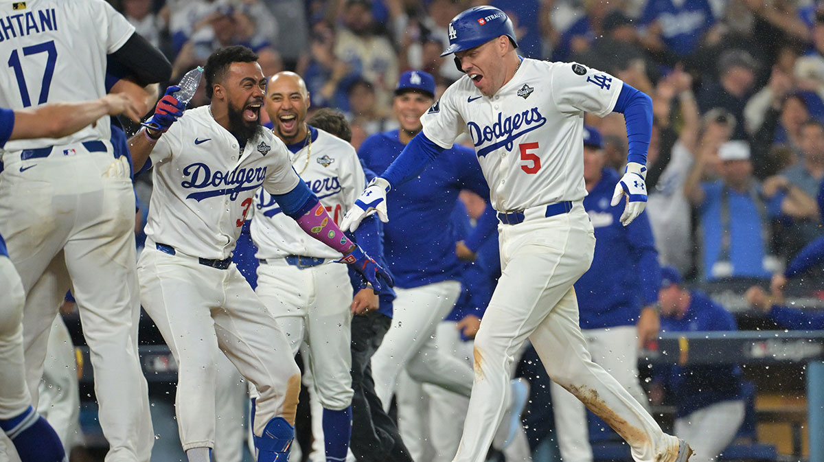 Dodgers first baseman Freddie Freeman (5) celebrates with teammates