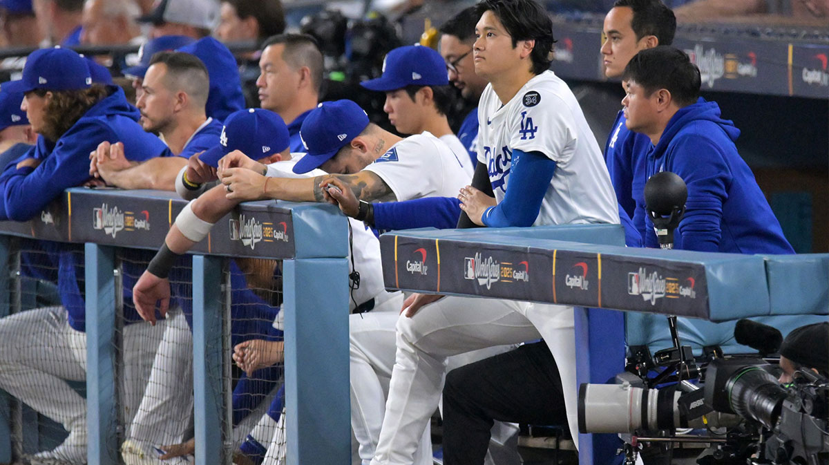 Los Angeles Dodgers two-way player Shohei Ohtani (17) looks on from the dugout in the ninth inning against the Toronto Blue Jays during game five of the 2025 MLB World Series at Dodger Stadium.