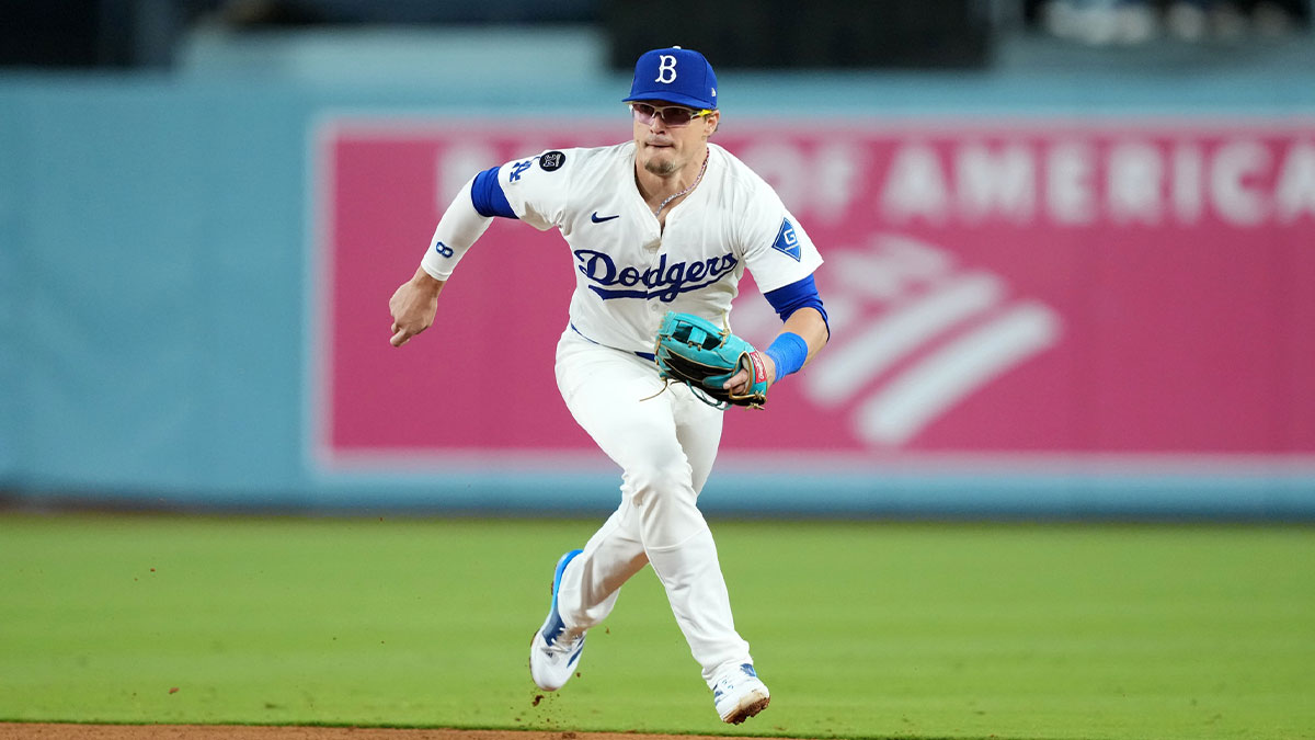Los Angeles Dodgers second baseman Kike Hernandez (8) fields a ground ball in the ninth inning against the Colorado Rockies at Dodger Stadium.