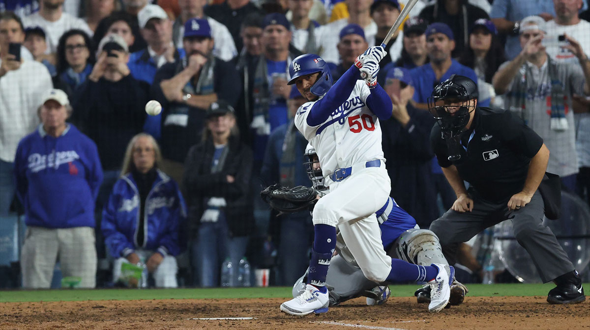 Los Angeles Dodgers shortstop Mookie Betts (50) singles during the eleventh inning against the Toronto Blue Jays in game three of the 2025 MLB World Series at Dodger Stadium.