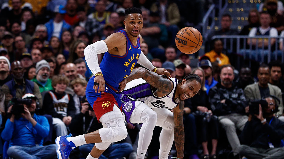 Denver Nuggets guard Russell Westbrook (4) strips the ball away from Sacramento Kings forward DeMar DeRozan (10) in the second quarter at Ball Arena.