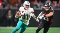 Miami Dolphins running back Ollie Gordon II (31) runs the ball against the Atlanta Falcons in the third quarter at Mercedes-Benz Stadium.