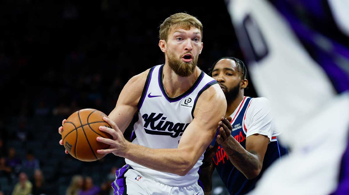 Sacramento Kings center Domantas Sabonis (11) controls the ball against Los Angeles Clippers guard Jordan Miller (22) during the first quarter at Golden 1 Center.