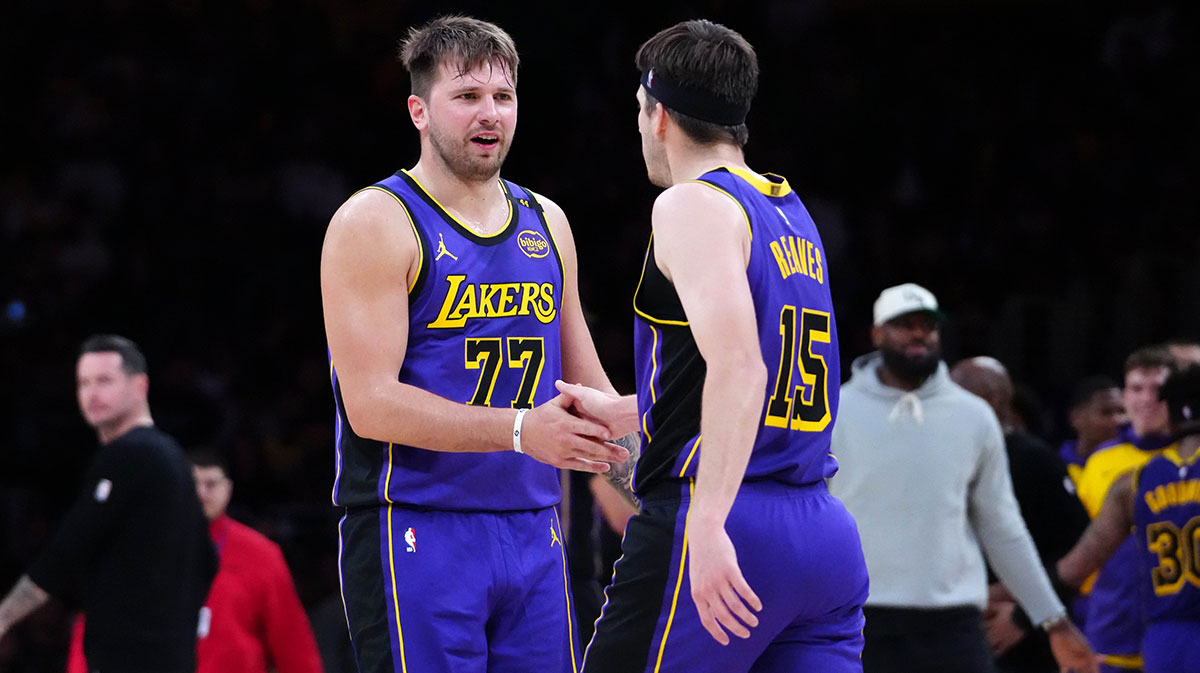 Los Angeles Lakers guard Luka Doncic (77) and guard Austin Reaves (15) react against the San Antonio Spurs in the first half at Crypto.com Arena.