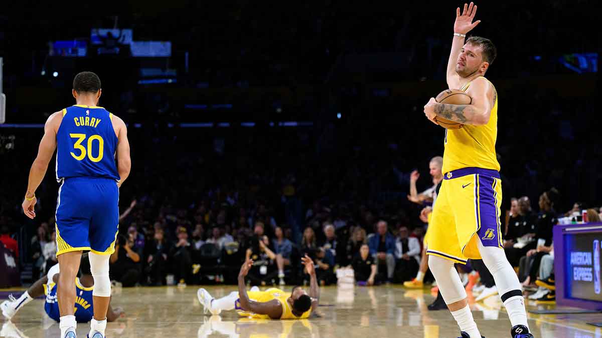 Los Angeles Lakers guard Luka Doncic (77) reacts after an offensive foul call on guard Marcus Smart (36) during the first half against the Golden State Warriors at Crypto.com Arena.