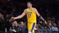 Los Angeles Lakers guard Luka Doncic (77) returns to the bench in the fourth quarteragainst the Minnesota Timberwolves at Crypto.com Arena