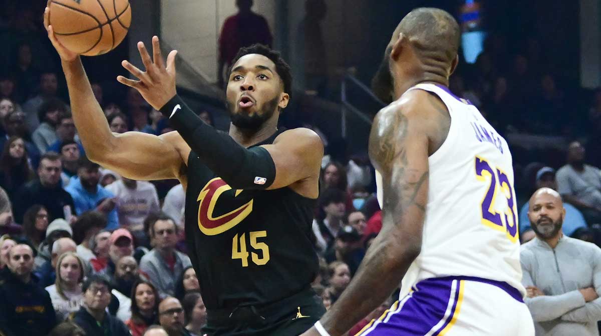 Cleveland Cavaliers guard Donovan Mitchell (45) drives to the basket against Los Angeles Lakers forward LeBron James (23) during the first half at Rocket Mortgage FieldHouse.
