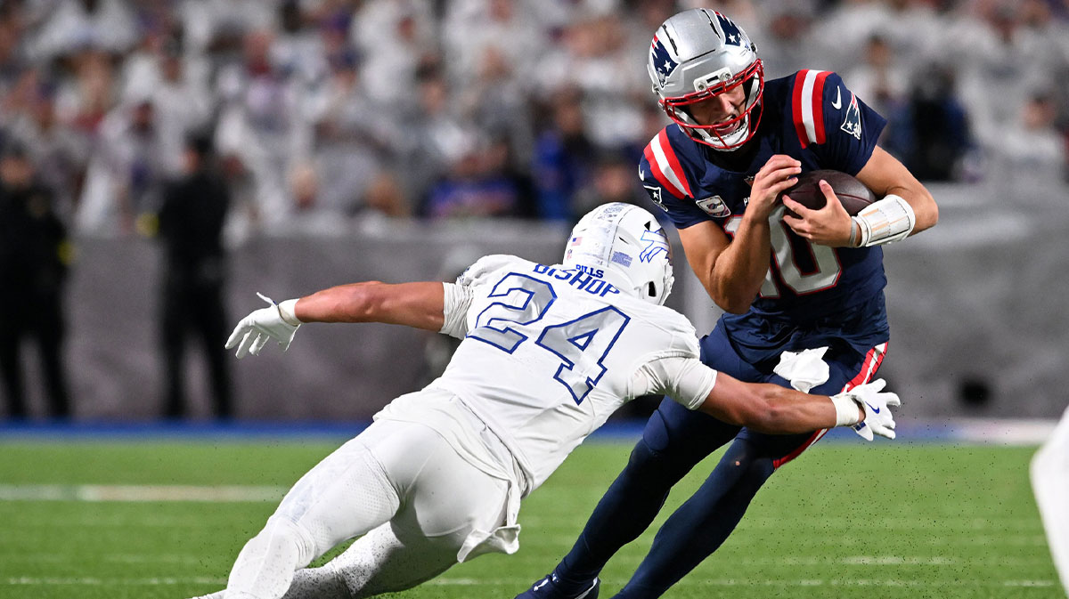 New England Patriots quarterback Drake Maye (10) rushes the ball against Buffalo Bills safety Cole Bishop (24) during the second half at Highmark Stadium.