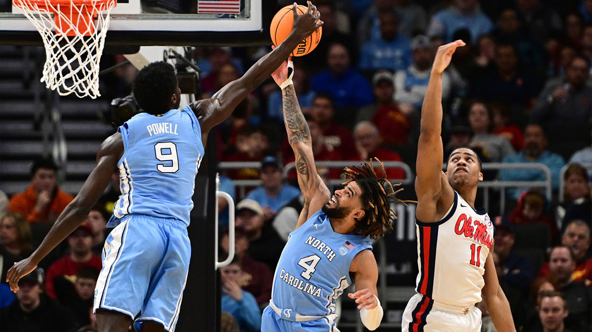 North Carolina Tar Heels guard Drake Powell (9) and guard RJ Davis (4) rebound against Mississippi Rebels guard Matthew Murrell (11) during the first half of a first round NCAA men’s tournament game at Fiserv Forum.