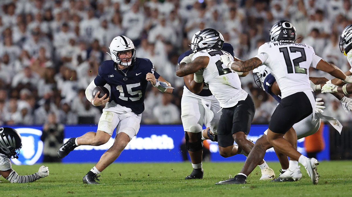 Penn State Nittany Lions quarterback Drew Allar (15) runs for a gain during the fourth quarter against the Oregon Ducks at Beaver Stadium.