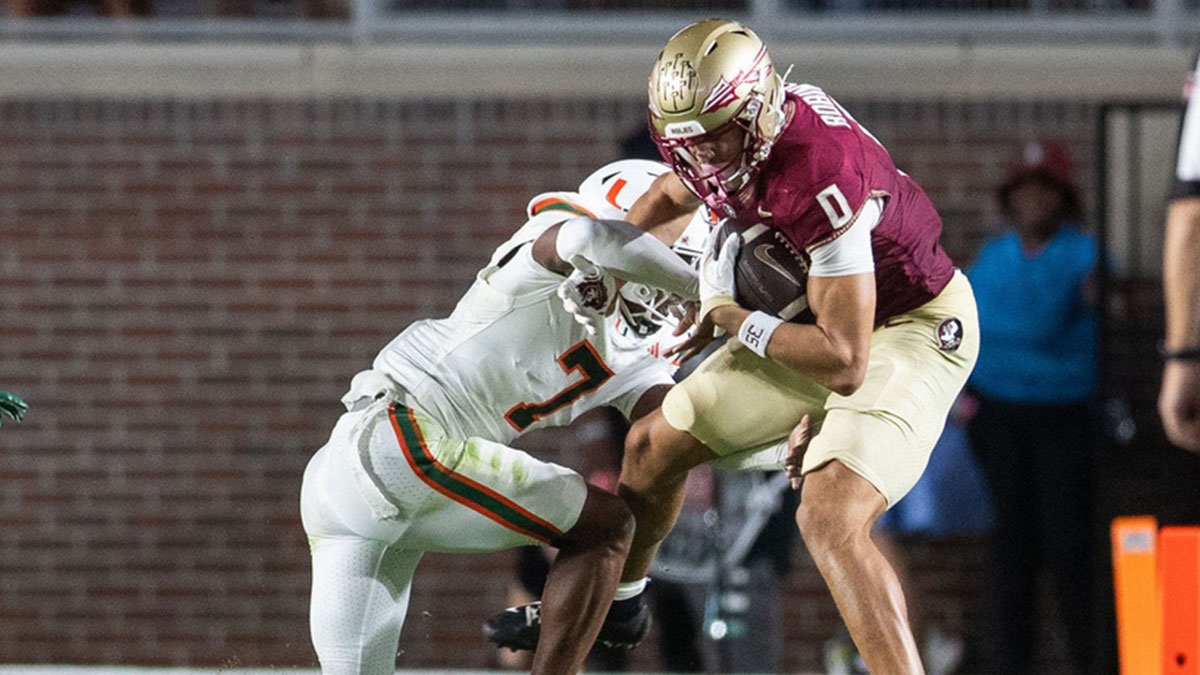 Florida State Seminoles wide receiver Duce Robinson (0) fights off a defender as he runs the ball down the field. The Miami Hurricanes defeated the Florida State Seminoles 22-28 at Doak Campbell Stadium on Saturday, Oct. 4, 2025.