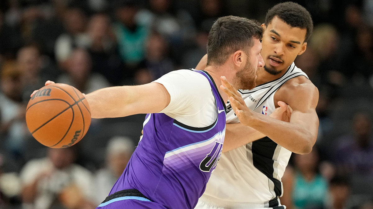 San Antonio Spurs forward Victor Wembanyama (1) defends Utah Jazz center Jusuf Nurkic (30) during the first half at Frost Bank Center.