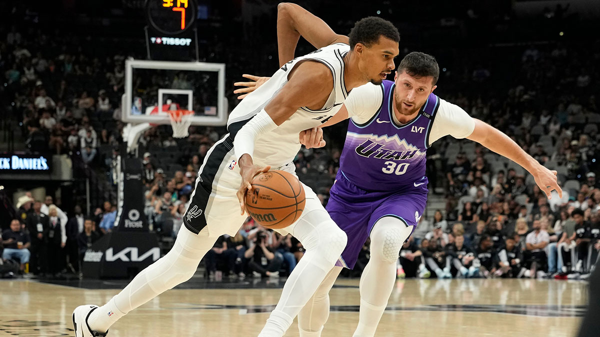 San Antonio Spurs forward Victor Wembanyama (1) drives to the basket against Utah Jazz center Jusuf Nurkic (30) during the first half at Frost Bank Center.