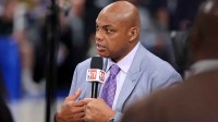 analyst Charles Barkley talks on set before game three of the 2024 NBA Finals between the Boston Celtics and the Dallas Mavericks at American Airlines Center with players load management in the background