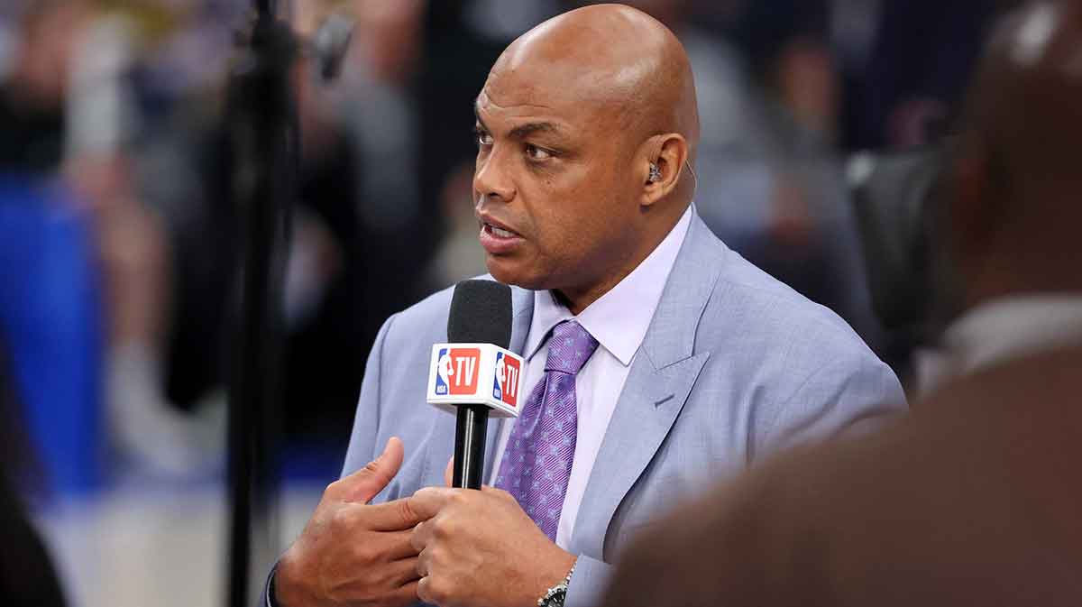 analyst Charles Barkley talks on set before game three of the 2024 NBA Finals between the Boston Celtics and the Dallas Mavericks at American Airlines Center with players load management in the background