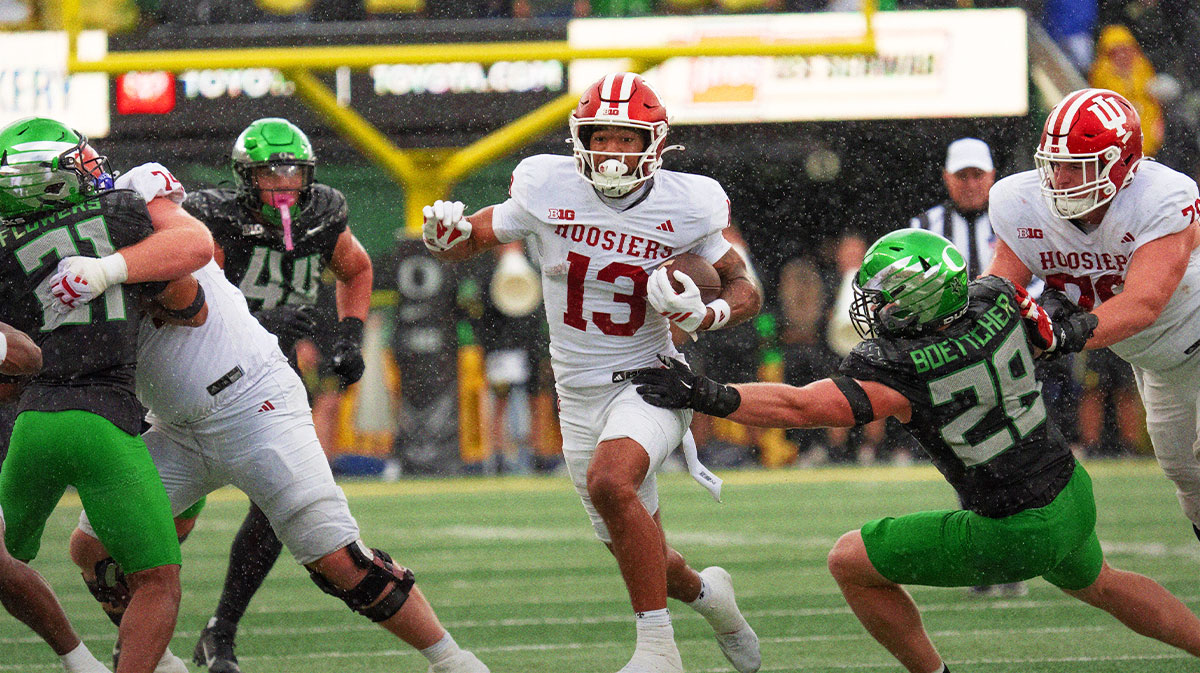 Indiana’s Elijah Sarratt, center, rushes against Oregon during the fourth quarter at Autzen Stadium October 11, 2025.