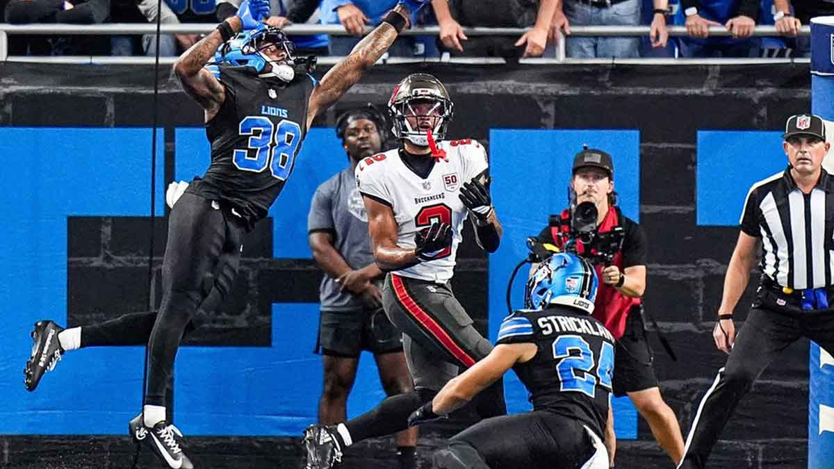 Tampa Bay Buccaneers quarterback Baker Mayfield (6) makes a pass against Detroit Lions defensive end Aidan Hutchinson (97) during the second half at Ford Field in Detroit on Monday, Oct. 20, 2025.