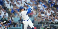 Los Angeles Dodgers first baseman Enrique Hernandez (8) hits an RBI sacrifice fly against the Toronto Blue Jays in the second inning during game four of the 2025 MLB World Series at Dodger Stadium.