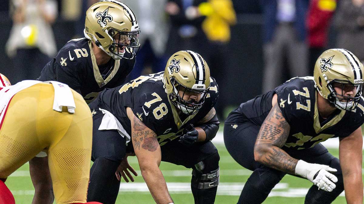 New Orleans Saints center Erik McCoy (78) hikes the ball to quarterback Spencer Rattler (2) against the San Francisco 49ers during the second half at Caesars Superdome.