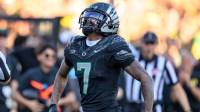 Oregon Ducks wide receiver Evan Stewart (7) celebrates a big catch during the second half against the Ohio State Buckeyes at Autzen Stadium.