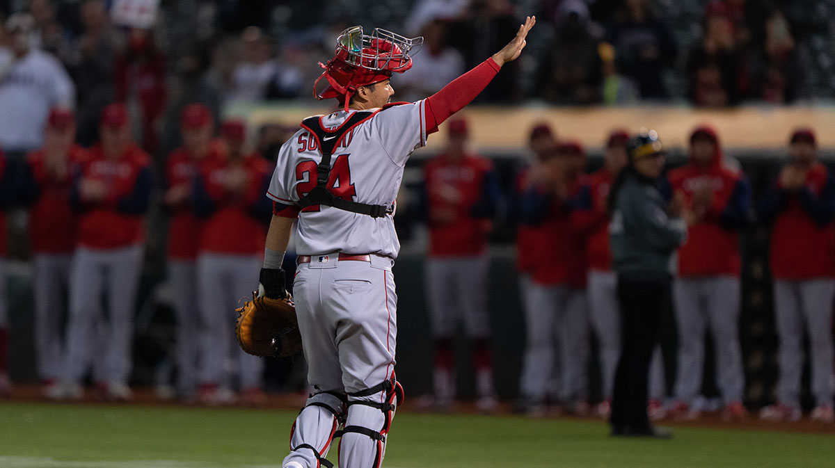 Los Angeles Angels catcher Kurt Suzuki (24) waves to the crowd as he retires from baseball during the first inning against the Oakland Athletics at RingCentral Coliseum.