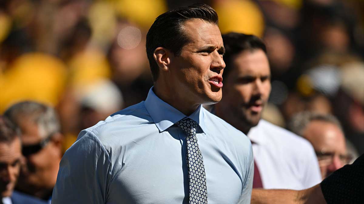 Fox Sports football analyst Brady Quinn on the sidelines during the game between the Iowa Hawkeyes and the Michigan Wolverines at Kinnick Stadium.