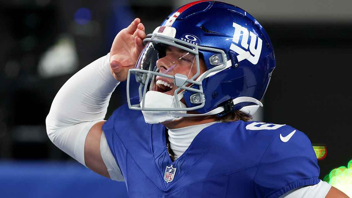 New York Giants quarterback Jaxson Dart (6) celebrates after scoring a touchdown against the Philadelphia Eagles of the game at MetLife Stadium.